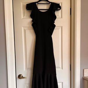 Black backless dress with ruffle detail